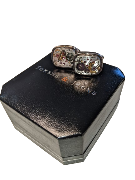 Antique Watch Cufflinks sitting on a black jewellry box