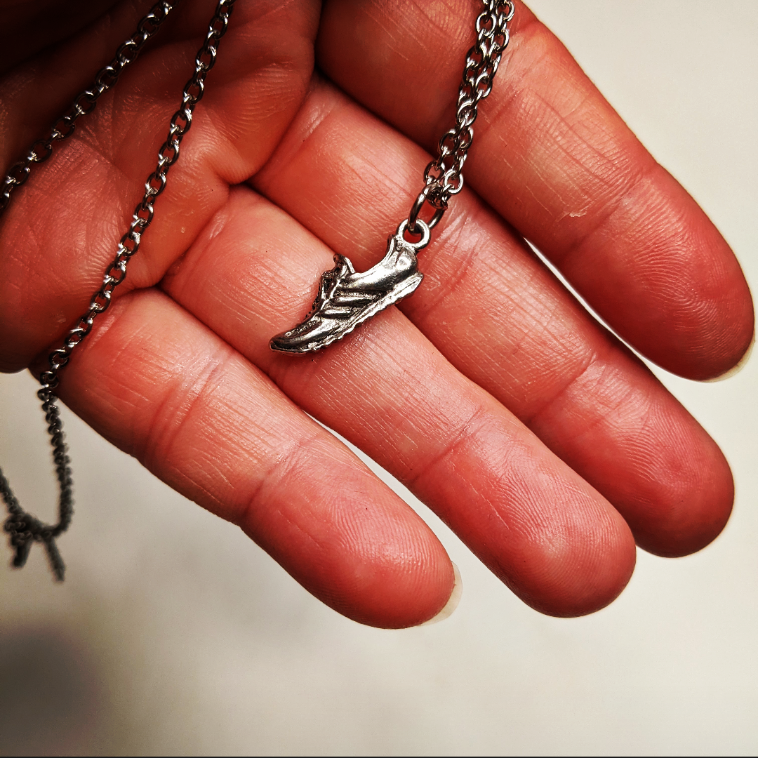 Anecklage with a running shoe charm