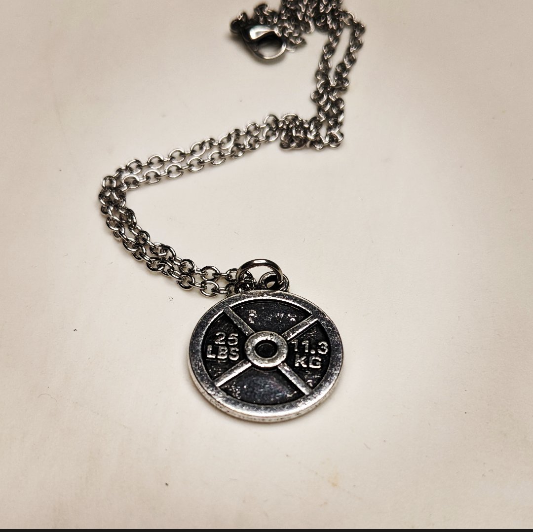 necklace with a weight plate charm this shows 25 lbs on it