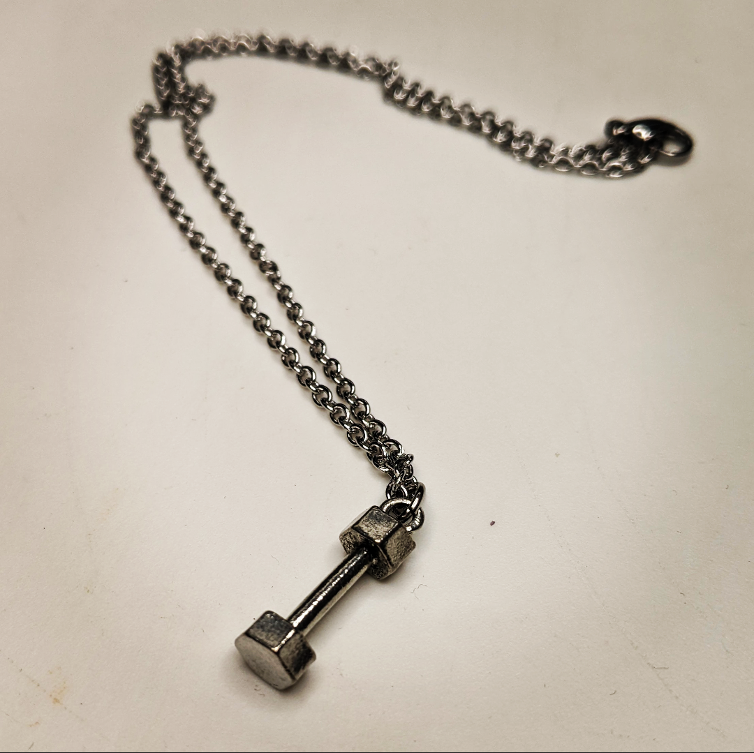 Necklace with a dumb bell charm on it